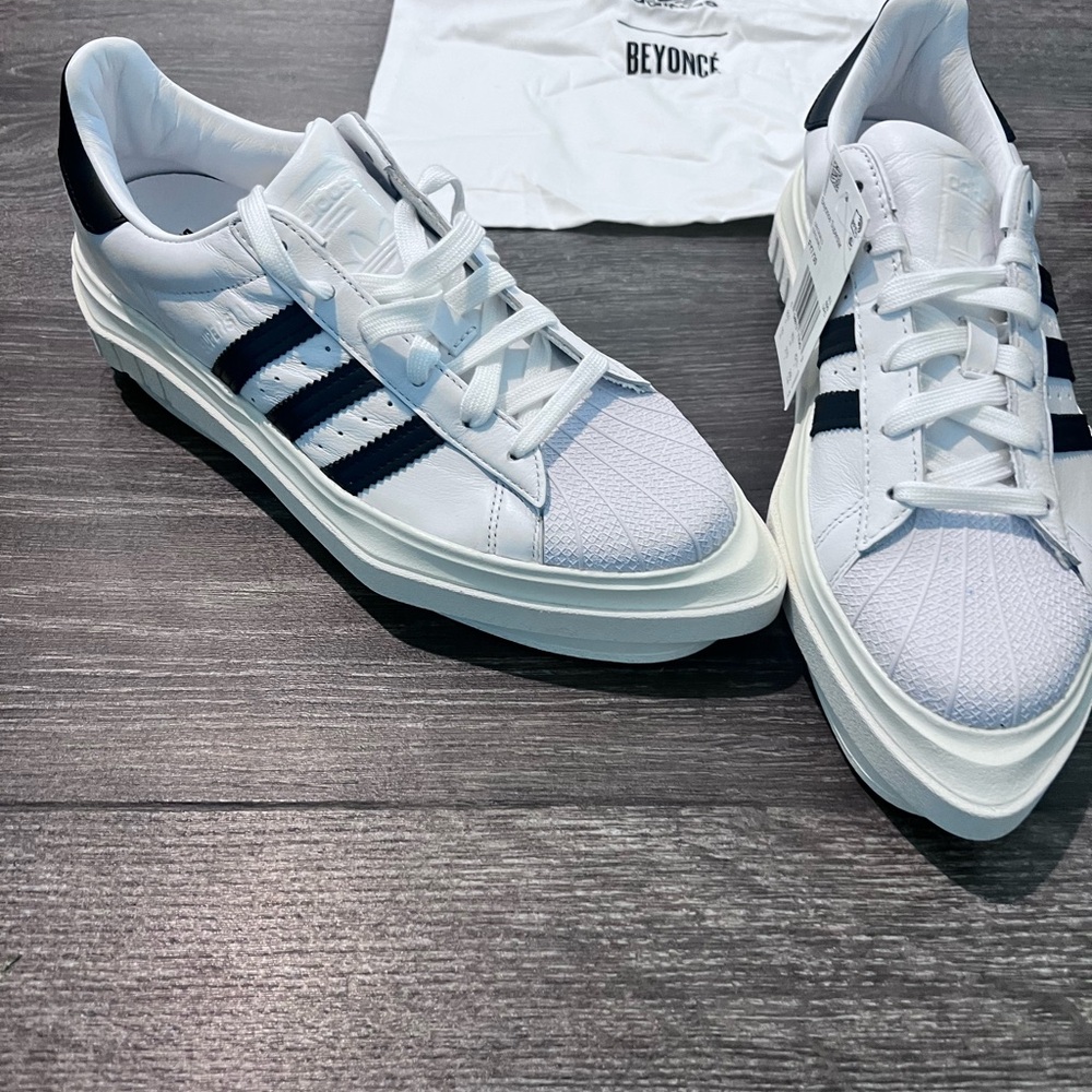 adidas White and Black Sneakers with Leather Material and Low-Top Design